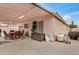 Covered patio with a dining set, offering a great outdoor space for entertainment at 10407 W Reade Ave, Glendale, AZ 85307