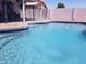 Crystal clear swimming pool with fencing in a backyard on a sunny day at 10407 W Reade Ave, Glendale, AZ 85307