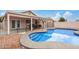 Backyard pool featuring fencing, patio access, and desert landscaping, for leisure at 10407 W Reade Ave, Glendale, AZ 85307