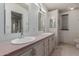 Bathroom featuring a double vanity, two mirrors and vanity lighting at 1053 S 96Th St, Mesa, AZ 85208