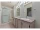 Bright bathroom with double sinks, spacious counter and a shower with glass door at 1053 S 96Th St, Mesa, AZ 85208