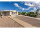 Exterior featuring a covered parking area and drought-resistant landscaping at 1053 S 96Th St, Mesa, AZ 85208
