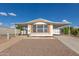 Charming home featuring a covered carport and low-maintenance front yard at 1053 S 96Th St, Mesa, AZ 85208