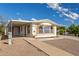 The home features covered parking area and drought-resistant landscaping at 1053 S 96Th St, Mesa, AZ 85208