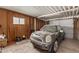 A Mini Cooper parked inside an enclosed garage and tools at 1053 S 96Th St, Mesa, AZ 85208