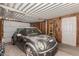 View of a single car garage with metal roofing, painted walls and a ladder at 1053 S 96Th St, Mesa, AZ 85208