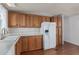 Bright kitchen featuring wooden cabinets, white countertops, and modern appliances at 1053 S 96Th St, Mesa, AZ 85208