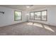 Bright living room featuring large windows that let in ample natural light at 1053 S 96Th St, Mesa, AZ 85208