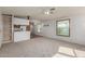 Open living space connecting kitchen and living room filled with natural light at 1053 S 96Th St, Mesa, AZ 85208
