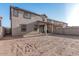 Backyard featuring a covered patio area and dirt landscaping at 10986 W Polk St, Avondale, AZ 85323