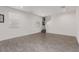 Spacious living room with neutral tile flooring, recessed lighting, and bright natural light at 10986 W Polk St, Avondale, AZ 85323