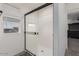 Modern walk-in shower with glass doors and a sleek black frame at 10986 W Polk St, Avondale, AZ 85323