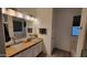 Bright bathroom featuring double glass bowl sinks, granite countertops, and modern fixtures at 11265 E Contessa St, Mesa, AZ 85207