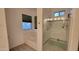 Modern bathroom with glass shower and separate bathtub, offering a clean and bright space at 11265 E Contessa St, Mesa, AZ 85207