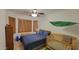 Charming bedroom featuring a crib, shutters, and a spacious closet for ample storage at 11265 E Contessa St, Mesa, AZ 85207