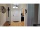 Inviting entryway with wood floors, and a view into other rooms of the house at 11265 E Contessa St, Mesa, AZ 85207