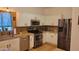 Updated kitchen featuring white cabinets, granite countertops, and stainless steel appliances at 11265 E Contessa St, Mesa, AZ 85207