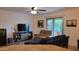 Inviting living room featuring comfortable seating, a flat-screen TV, and stylish decor at 11265 E Contessa St, Mesa, AZ 85207