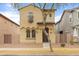 Charming two-story home featuring an eye-catching balcony and a well-manicured front yard at 11454 W St John Rd, Surprise, AZ 85378