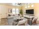 Bright living room featuring arched windows, modern furniture, and stylish decor creating an inviting atmosphere at 11454 W St John Rd, Surprise, AZ 85378