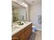 Bright bathroom with double vanity, modern fixtures, quartz countertop, and separate shower room at 11640 N Tatum Blvd # 1031, Phoenix, AZ 85028