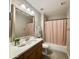 Bright bathroom featuring a single sink vanity, mirror, and a tub with shower curtain at 11640 N Tatum Blvd # 1031, Phoenix, AZ 85028
