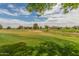 Picturesque view of the golf course with rolling green hills and distant mountains at 11640 N Tatum Blvd # 1031, Phoenix, AZ 85028