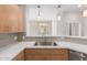 Beautifully appointed kitchen featuring modern stainless steel appliances and wooden cabinets at 11640 N Tatum Blvd # 1031, Phoenix, AZ 85028