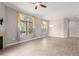 Open living area featuring a ceiling fan, fireplace, modern lighting, and stylish curtains at 11640 N Tatum Blvd # 1031, Phoenix, AZ 85028