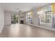 Bright living room featuring a fireplace, ceiling fan, and a sliding door for balcony access at 11640 N Tatum Blvd # 1031, Phoenix, AZ 85028