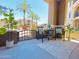 Inviting patio with seating area offering palm tree views and outdoor relaxation at 11640 N Tatum Blvd # 1031, Phoenix, AZ 85028