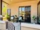 Relaxing patio area with comfortable seating, decorative plants, and sliding door access to the interior at 11640 N Tatum Blvd # 1031, Phoenix, AZ 85028