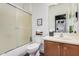 Bathroom includes a shower-tub combo, single sink vanity, and modern fixtures at 12335 W Rosewood Ln, Peoria, AZ 85383