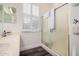 Bathroom features glass enclosed shower, single vanity, and window with blinds at 12335 W Rosewood Ln, Peoria, AZ 85383