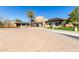 Exterior view of the clubhouse with stone and modern architecture and pristine landscaping at 12335 W Rosewood Ln, Peoria, AZ 85383