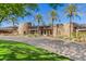 Exterior shot of the clubhouse showcasing its stacked stone architecture and desert-friendly landscaping at 12335 W Rosewood Ln, Peoria, AZ 85383
