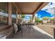 Relaxing covered patio offers outdoor seating and scenic backyard views at 12335 W Rosewood Ln, Peoria, AZ 85383
