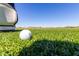 Close up view of a golf ball on the lush green course at 12335 W Rosewood Ln, Peoria, AZ 85383