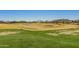 Scenic golf course view showing green fairway, sand traps, and distant residential homes at 12335 W Rosewood Ln, Peoria, AZ 85383