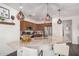 Well-lit kitchen featuring marble countertops, wooden cabinets, and a marble backsplash at 12335 W Rosewood Ln, Peoria, AZ 85383