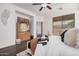 Bright main bedroom featuring modern flooring and a comfortable king bed at 12335 W Rosewood Ln, Peoria, AZ 85383