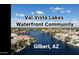 Aerial view showcases Val Vista Lakes, a waterfront community, in Gilbert, AZ, under a beautiful sky at 1414 N Palmsprings Dr, Gilbert, AZ 85234