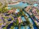 Aerial view of Val Vista Lakes community featuring tennis courts, pool, and clubhouse, with lake access at 1414 N Palmsprings Dr, Gilbert, AZ 85234