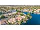 Aerial view of the Val Vista Lakes community showcasing homes with lake access and lush landscaping at 1414 N Palmsprings Dr, Gilbert, AZ 85234
