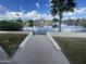 Backyard view leading to a serene lake, enhanced with a secure gated entrance for lakeside enjoyment at 1414 N Palmsprings Dr, Gilbert, AZ 85234