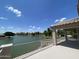 Open-air view from a balcony overlooking the tranquil lake and green trees at 1414 N Palmsprings Dr, Gilbert, AZ 85234