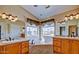 Spacious bathroom with dual vanities, soaking tub, and modern fixtures at 1414 N Palmsprings Dr, Gilbert, AZ 85234