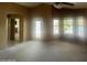 View of the primary bedroom with an en-suite bathroom and a door leading to the backyard at 1414 N Palmsprings Dr, Gilbert, AZ 85234