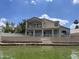 Waterfront home featuring balconies and access to the lake at 1414 N Palmsprings Dr, Gilbert, AZ 85234