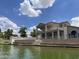 Exterior view from the lake showcasing balconies at 1414 N Palmsprings Dr, Gilbert, AZ 85234